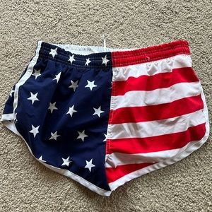 Board shorts. Swim trunks. Patriotic colors. Split sides.